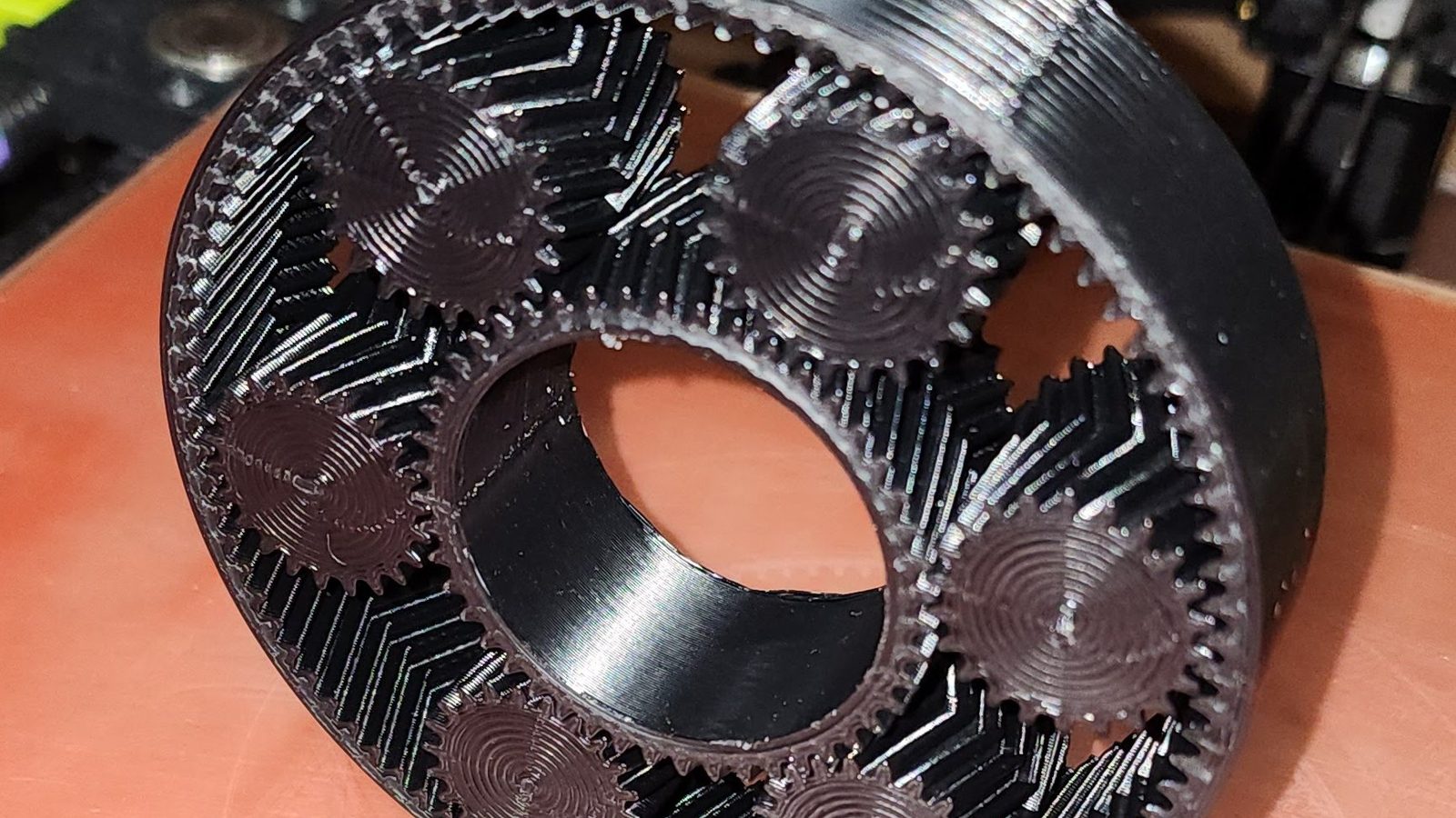 A 3D-printed planetary gear set on the workshop bench