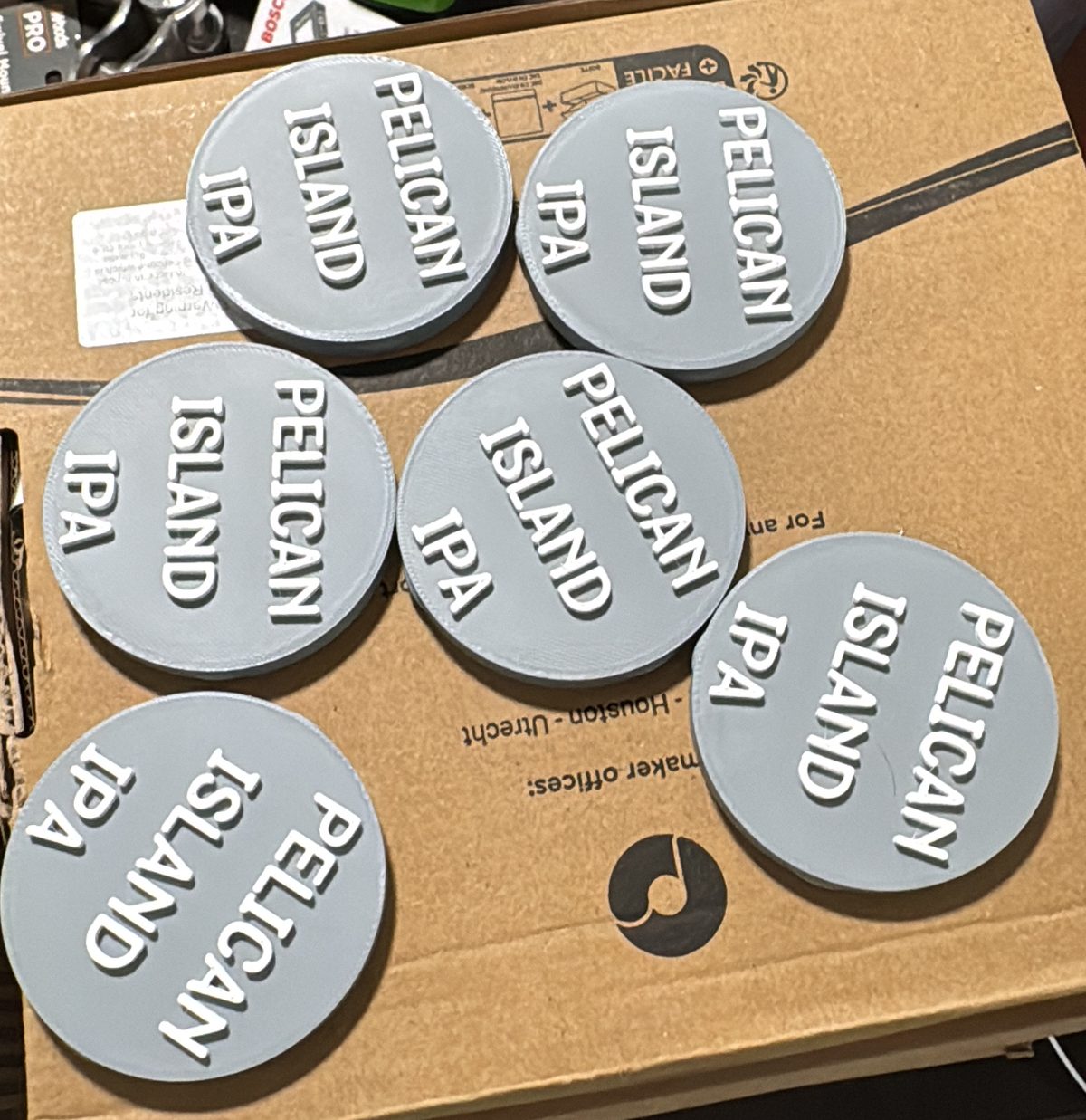 Custom 3D-printed beer tap handles with brewery badges